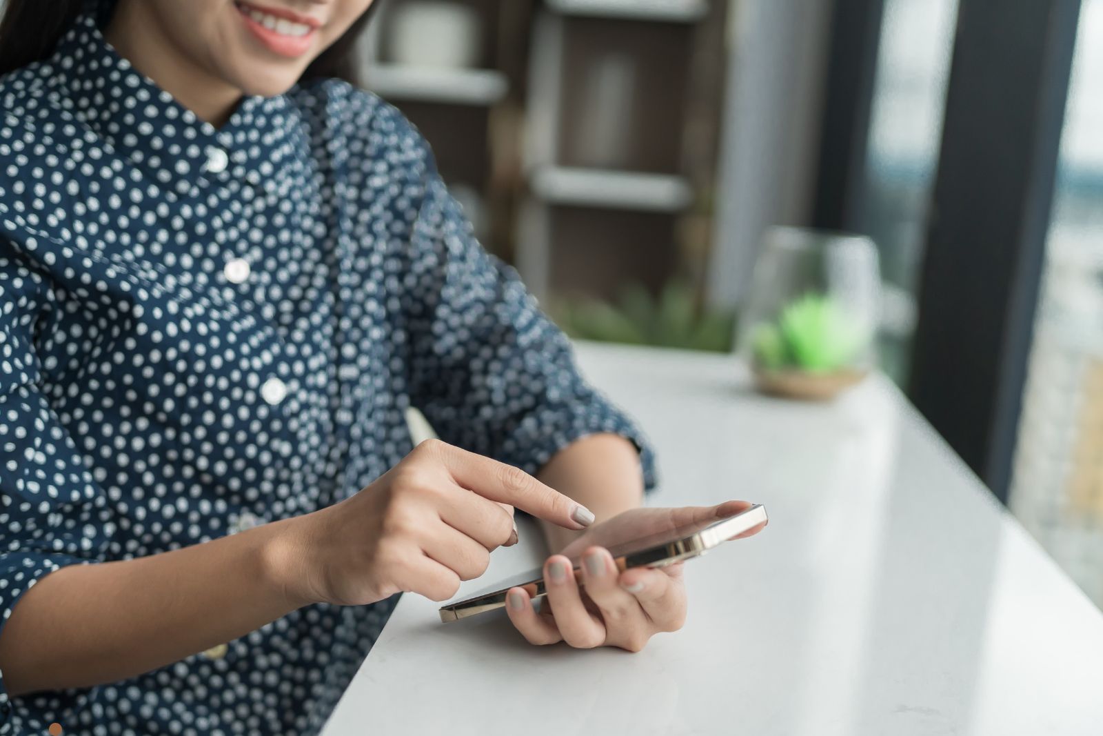 Person composing a message on smartphone